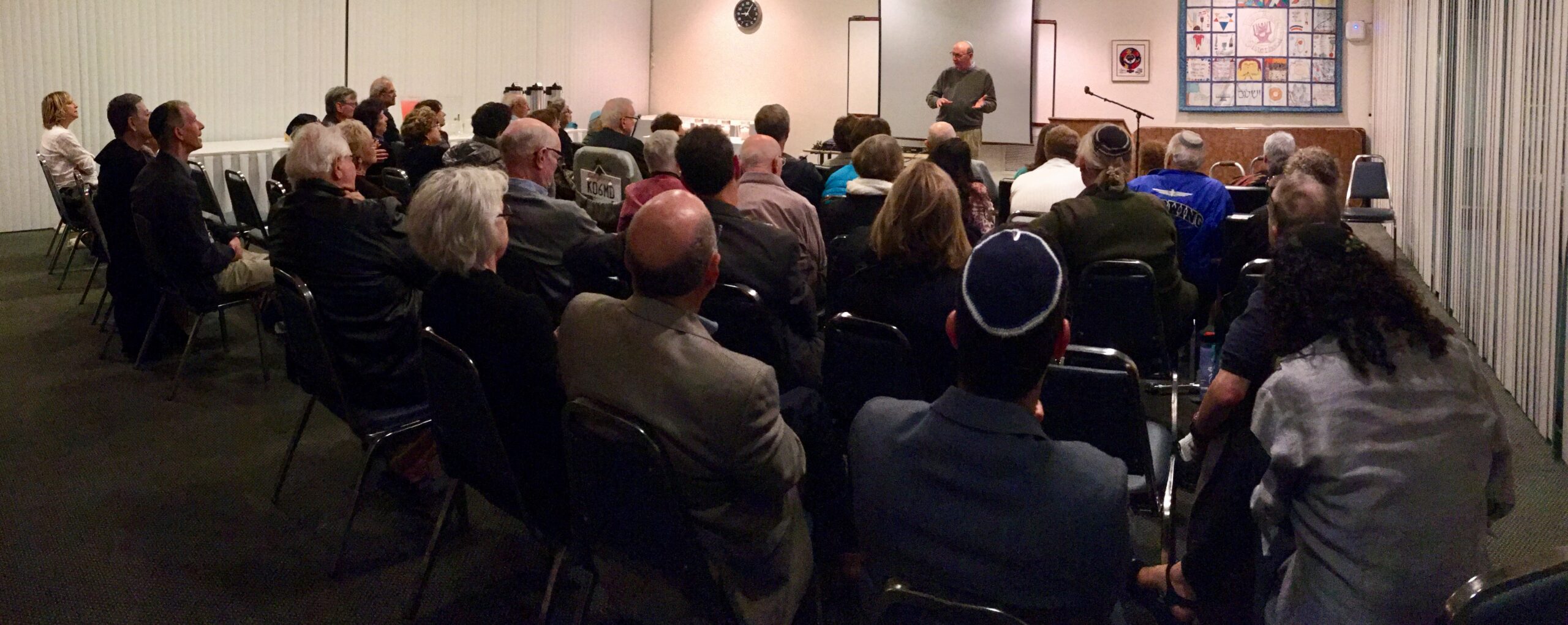 A group of people engaged in a lecture